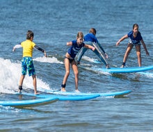 Learn to ride the waves with Skudin Surf in Long Beach. Photo by Jay Belsky