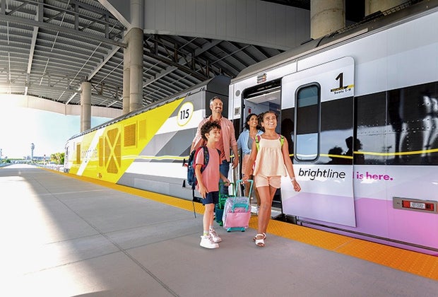 Family baording the Brightline trainstation in Orlando