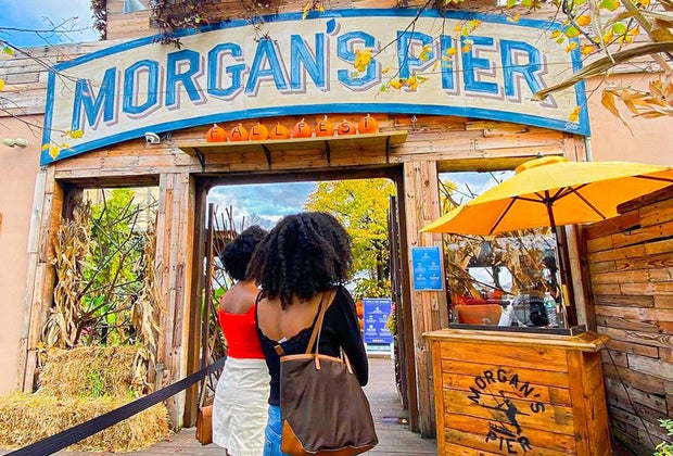 Two women entering Morgan's Pier restaurant