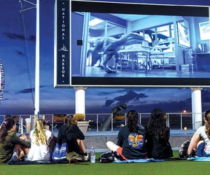 Catch a family-friendly flick along the Potomac River at Movies on the Potomac. Photo courtesy of National Harbor DC on Facebook