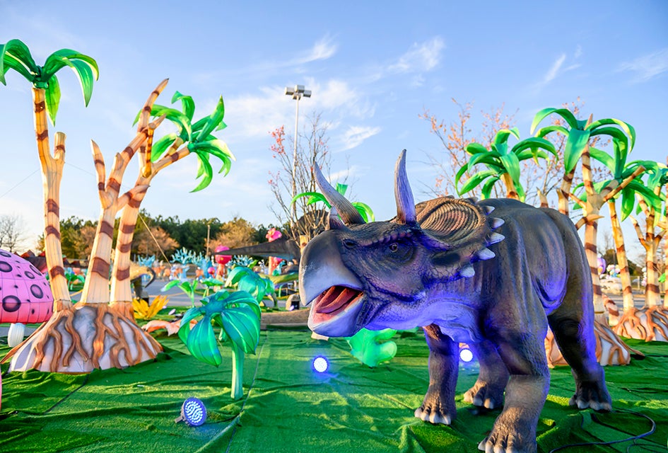 Go back to another time and make friends with dinosaurs! Check out LuminoCity Dino Safari in Orlando, now until June 16, 2024. Photo courtesy LuminoCity
