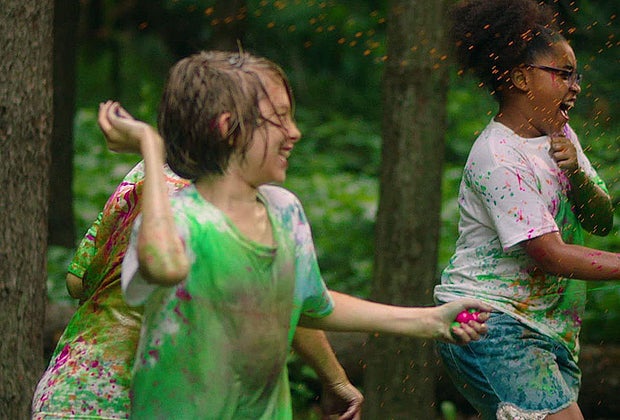 kids laughing and throwing goblies outside