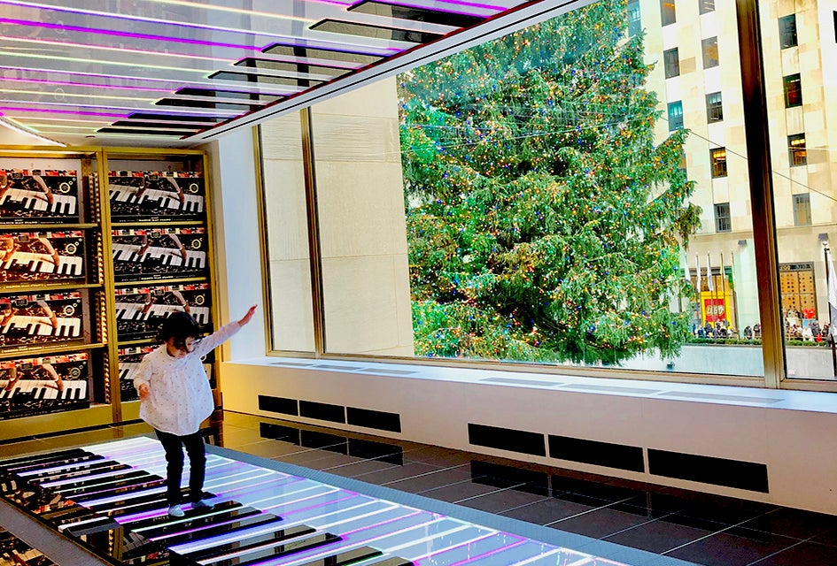 Play a tune on the piano mat at FAO Schwarz. Photo by Janet Bloom