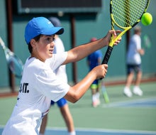 Kids can learn from top tennis coaches at Nike Tennis Camp. Photo courtesy of the camp