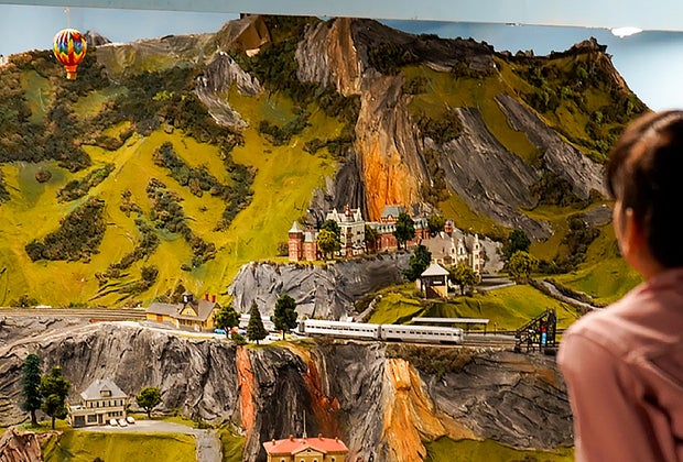 boy looking at model trains Northlandz