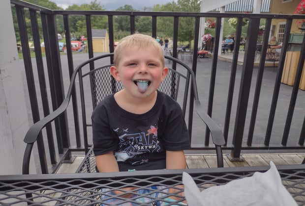 Boy sticks out his tongue at DuBois Farms