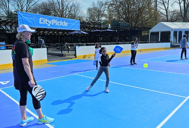 CityPickle pickleball in NYC: Close up of girl hitting a shot