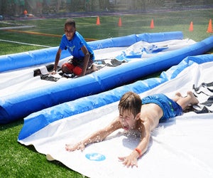 Splash and play at Asphalt Green's Sprinkler Day on Saturday, August 9. Photo courtesy of Asphalt Green