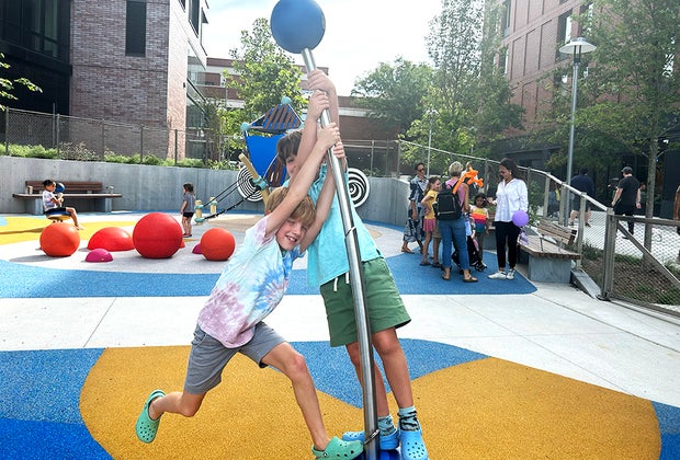 Pacific Park Playground in NYC: Playing on the bendy poles