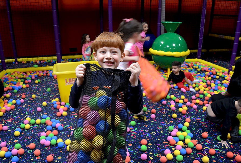 Party-goers burn tons of energy during an action-packed party at Laser Bounce. Photo by Sydney Ng