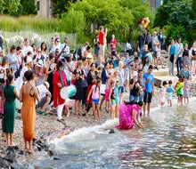 The annual Aarti Hindu Lamp Ceremony returns to Brooklyn Bridge Park's Pebble Beach! Photo by Etienne Frossard