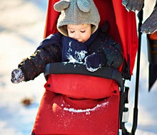 A footmuff envelops tots in cozy warmth in their stroller. Photo courtesy of Bugaboo