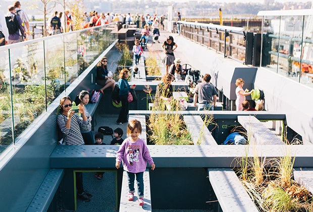 Kids play on the Pershing Square Beams in NYC's High Line park