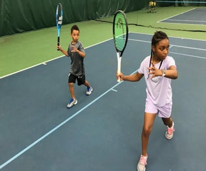 Kids perfect technique at Legacy Youth Tennis and Education Camps. Photo courtesy of Legacy Youth Tennis and Education Camps