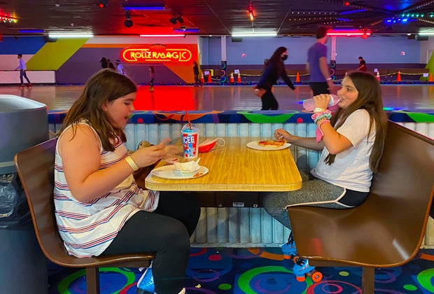 Photo of kids eating pizza- Indoor Places for Teens and Tweens to Hang Out