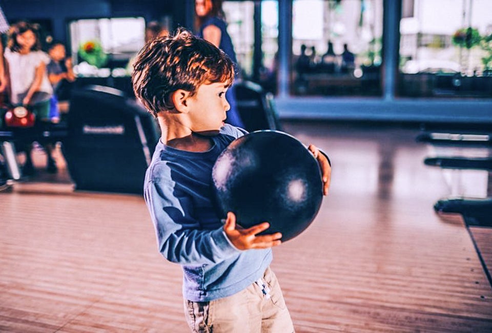 The Best Chicago Restaurants Where Kids Can Play Little boy trying for a strike! Photo courtesy of Pinstripes
