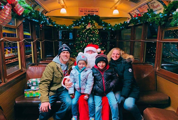 Photo of family on Santa's lap - Polar Express Train Rides and Christmas Trains