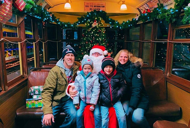 Photo of family on Santa's lap - Polar Express Train Rides and Christmas Trains