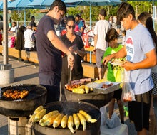 Enjoy the cool breeze coming off New York Harbor while barbecuing in Brooklyn Bridge Park. Photo by Etienne Frossard