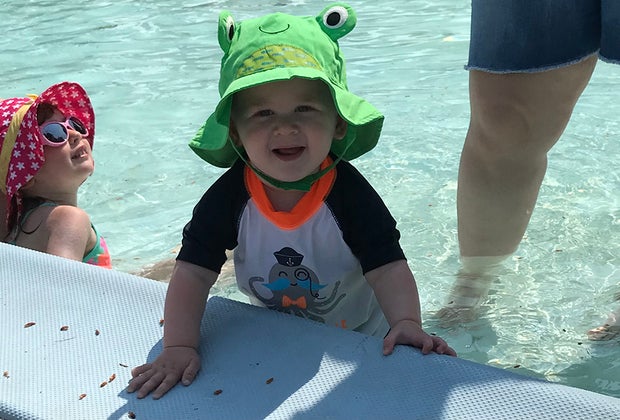 a toddler in a kiddie pool