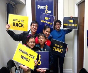 Work together to solve clues at Puzzle Out, one of our favorite family-friendly escape rooms in New Jersey. 