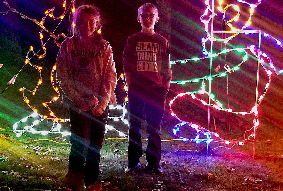 Things To Do in Long Island this Weekend: Holiday Boat Parade, Disney on Ice Kids will love getting into the holiday spirit at the Riverhead Holiday Light Show. Photo courtesy of the event
