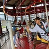 Grab the brass ring and get a free ride at Greenport's carousel. Photo by Jaime Sumersille
