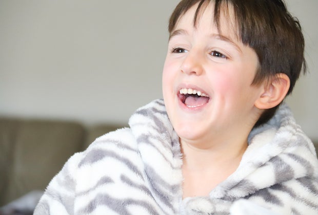 Smiling boy at riddles for kids