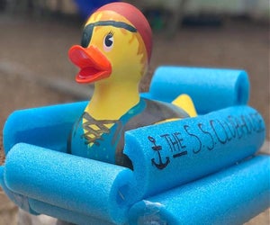 Enjoy a duck race at the historic Flower Bridge in Simsbury. Photo courtesy of Simsbury Duck Race