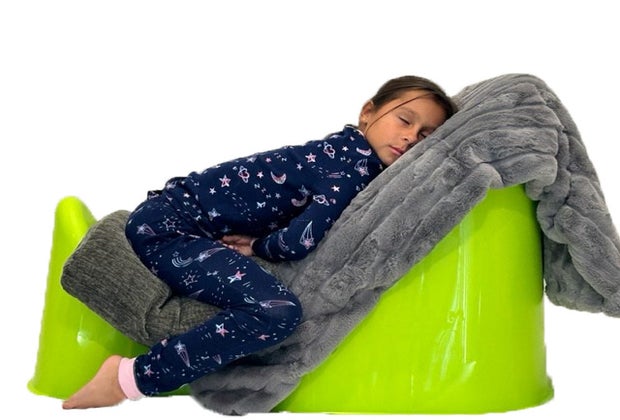 Safely help kids sleep when they've got colds with the Tum & Bum Sleeper, kid sleeping leaning propped up in chair