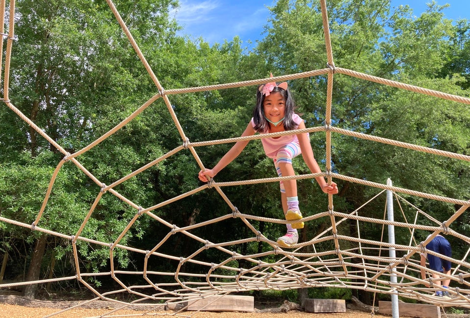 The Nature Playscape: Houston Arboretum's New Playground Was Worth the Wait Climbing the spiderweb. Photo by Vicki Li Yip