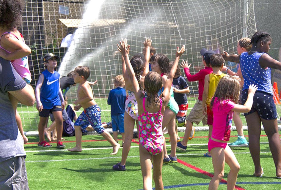 Free Activities in July: 81 Best Things To Do with Kids in NYC Slip and slide your way to smiles during Asphalt Green's Sprinkler Day. Photo courtesy of Asphalt Green