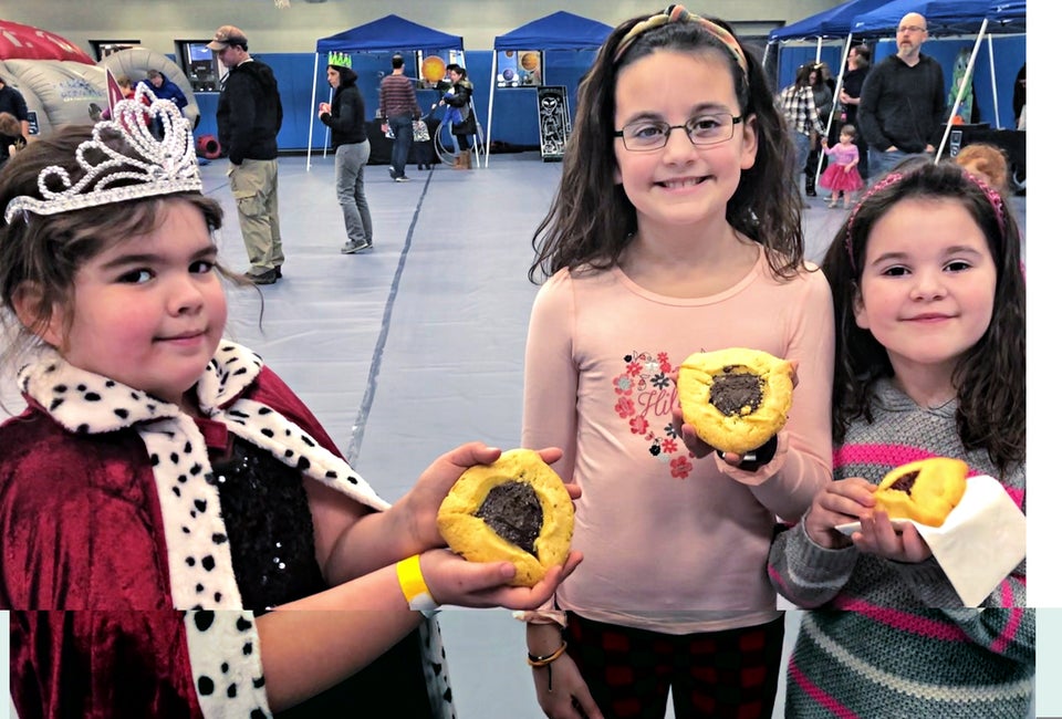 Kids display their hamantaschen at the Zoo Purim Carnival in Stamford. Photo by Ally Noel