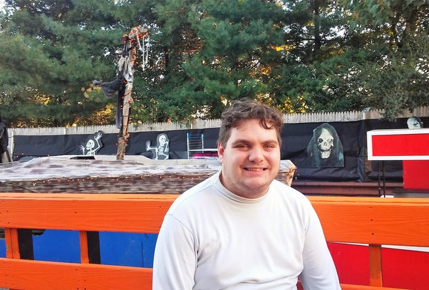 Man poses with Stew Leonard's Halloween display in Yonkers