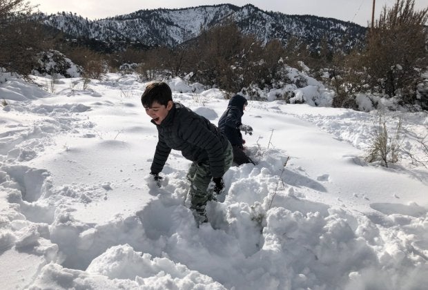 Visit Wrightwood and let your SoCal kids play in piles of pristine snow. Photo courtesy of Mommy Poppins