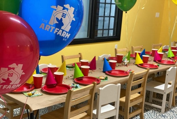 The Art Farm offers a delightful backdrop for a first birthday celebration—live animals included. Photo courtesy of the venue