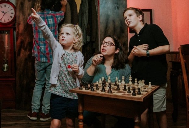 Participants work together to solve puzzles and escape a themed room before time runs out at Breakout Games. Photo by Faith Neece