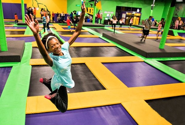 Raise your hand if you love visiting the best indoor trampoline parks in Connecticut! Photo courtesy of Get Air Sports