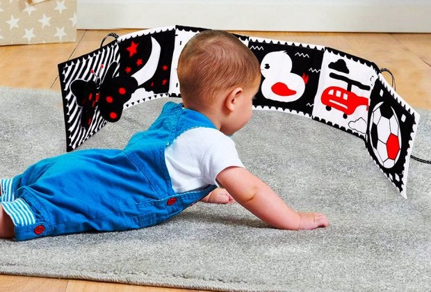 Black-and-white toys and books, like this Thremhoo foldout book, are the perfect first tummy-time playthings. 