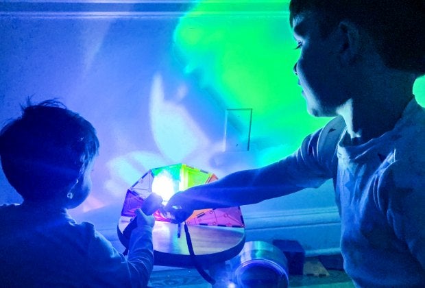 Who needs a disco ball when you've got a flashlight and magnetic tiles? Photo by author Liz Baill @creativishmom