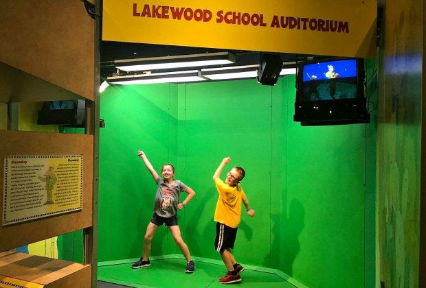 Jump on the greenscreen set and see yourself on TV