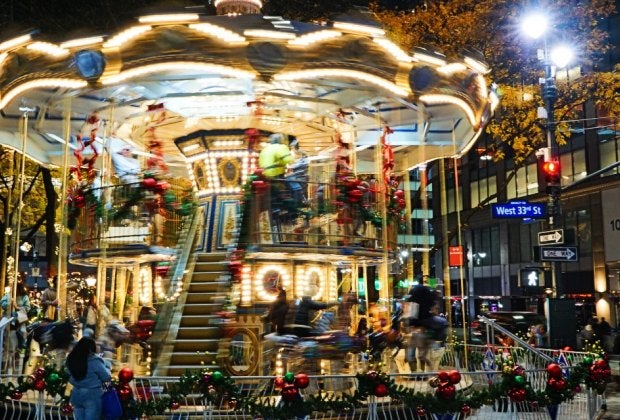The double-decker Christmas Carousel is now spinning at Greeley Square through the holidays. Photo by author