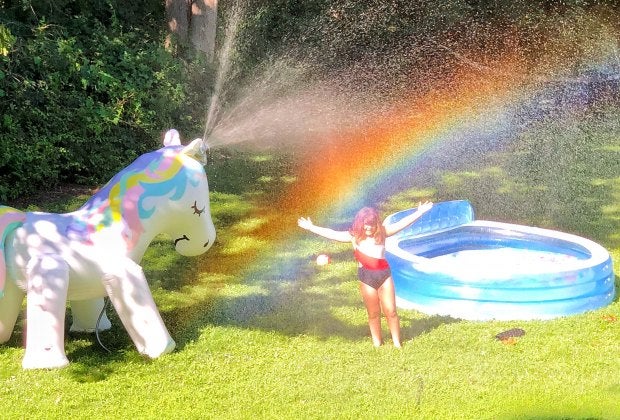 Set up a kiddie pool and mega sprinkle for backyard summer fun. Photo by Ally Noel