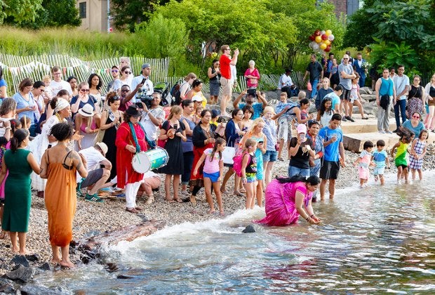 The annual Aarti Hindu Lamp Ceremony returns to Brooklyn Bridge Park's Pebble Beach! Photo by Etienne Frossard