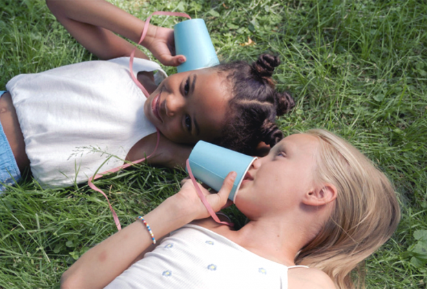 Nothing makes friends faster than sharing secrets, even if that secret is as simple as a favorite color! Photo by Ron Lach