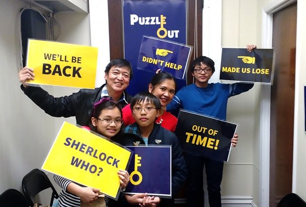 Work together to solve clues at Puzzle Out, one of our favorite family-friendly escape rooms in New Jersey. 