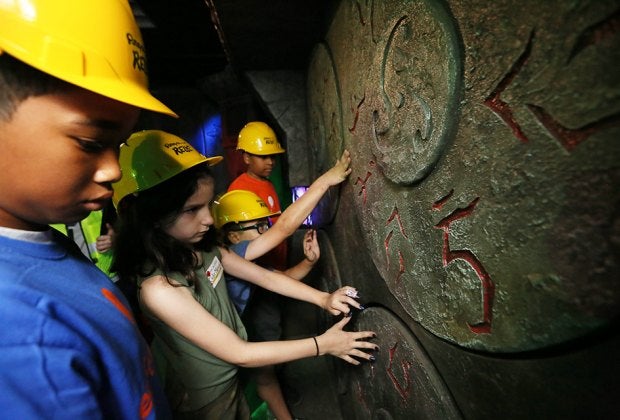 Kids embark on a quest at Ripley's Relic in Times Square. Photo by Stuart Ramson/AP Images