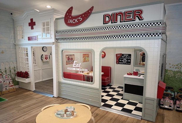 Schoolhouse Play & Cafe houses an enchanting play village for kids to explore. 