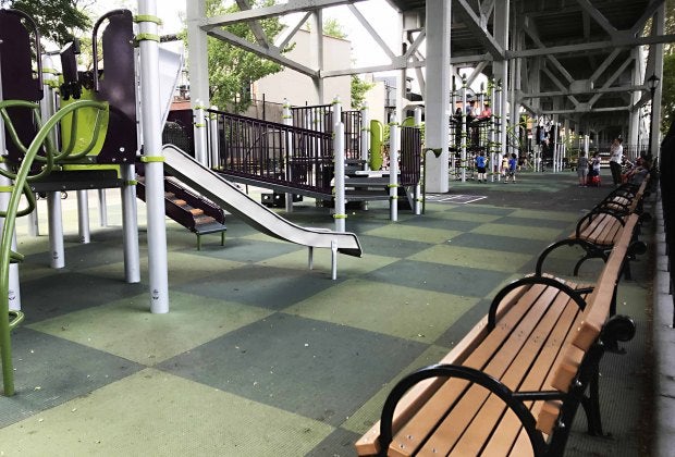 St. Mary's Park in Carroll Gardens is tucked in the shade beneath train tracks. Photo by Jeffrey Locke