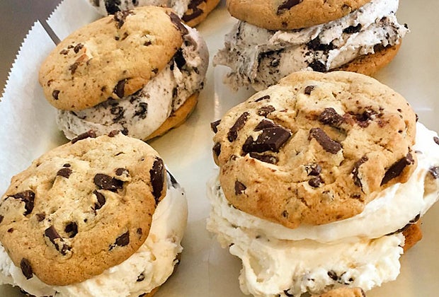 Enjoy a cookie ice cream sandwich at Sweet Treats, one of the top ice cream parlors in Long Island
